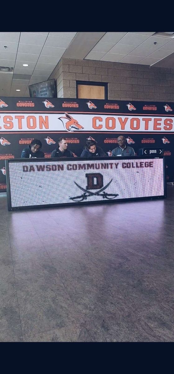 Aaron Sikes signs at Dawson College